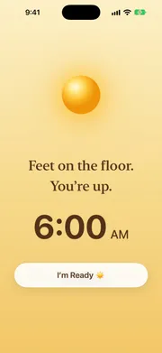 Sunvior alarm screen at sunrise showing the affirmation “Feet on the floor. You’re up.” above the alarm time and an I’m Ready button.